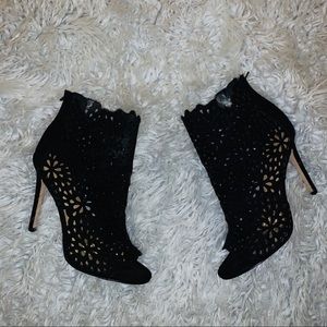 Black open toe ankle booties.